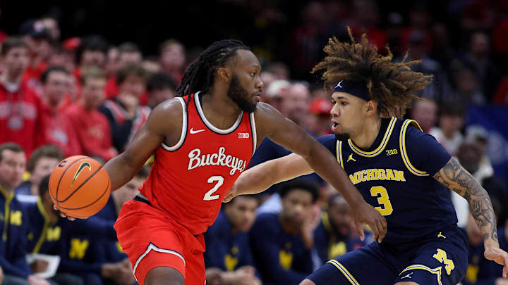 Feb 16, 2025; Columbus, Ohio, USA;  Ohio State Buckeyes guard Bruce Thornton (2) dribbles the ball as Michigan Wolverines guard Tre Donaldson (3) defends during the first half at Value City Arena. Mandatory Credit: Joseph Maiorana-Imagn Images
