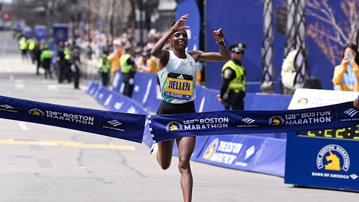 Hellen Obiri of Kenya crosses the finish line to win the women's division at the 2024 Boston Marathon.