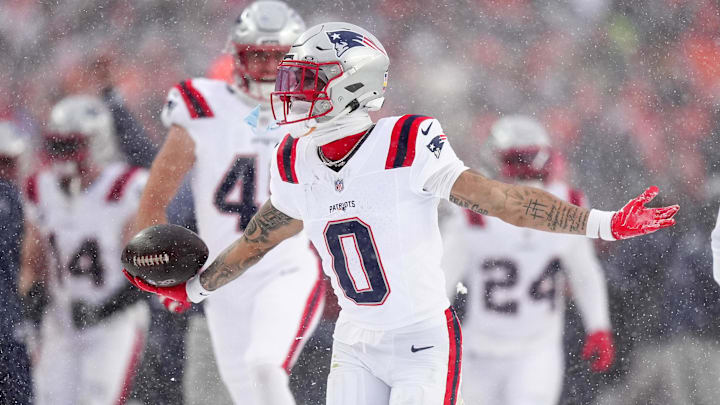 Patriots cornerback Christian Gonzalez celebrates after sealing New England's win over the Broncos with an interception late in the fourth quarter of the AFC championship game.