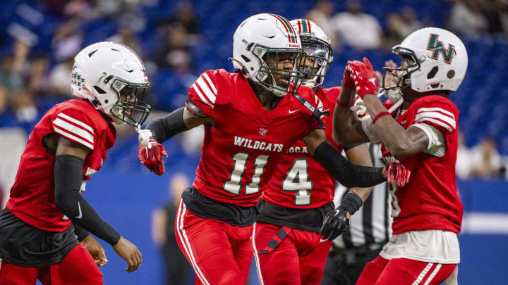 Lawrence North High School junior Jerome Smith (11) reacts after grabbing an interception during the second half of an IHSAA varsity football game against Lawrence Central High School, Friday, Sept. 1, 2023, at Lucas Oil Stadium in Indianapolis. Lawrence North High School won 41-26.