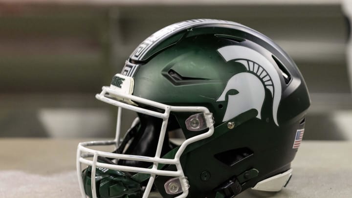 Nov 24, 2023; Detroit, Michigan, USA; A Michigan State Spartans helmet sits on a bench during the second half game against the Penn State Nittany Lions at Ford Field. Mandatory Credit: David Reginek-USA TODAY Sports
