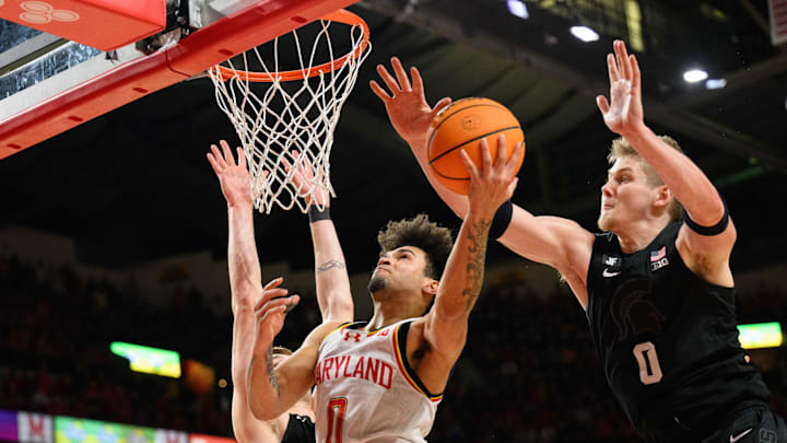 Feb 26, 2025; College Park, Maryland, USA; Maryland Terrapins guard Ja'Kobi Gillespie (0) drives to the basket against Michigan State Spartans forward Jaxon Kohler (0) during the second half at Xfinity Center. Mandatory Credit: Reggie Hildred-Imagn Images