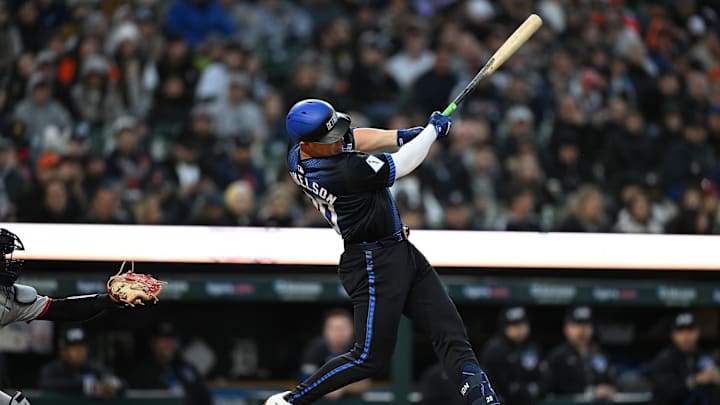 May 23, 2025; Detroit, Michigan, USA; Detroit Tigers first baseman Spencer Torkelson (20) hits a solo home run against the Cleveland Guardians in the sixth inning at Comerica Park. 