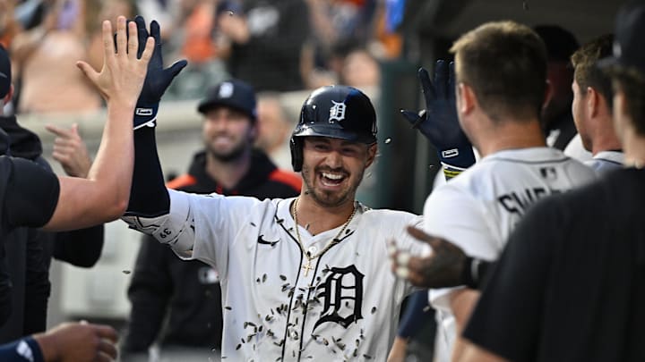 Jul 7, 2025; Detroit, Michigan, USA; Detroit Tigers right fielder Zach McKinstry (39) gets showered with sunflower seeds as he celebrates in the dugout after hitting a home run against the Tampa Bay Rays in the seventh inning at Comerica Park. 