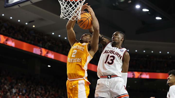Jan 25, 2025; Auburn, Alabama, USA;  Auburn Tigers guard Miles Kelly (13) blocks a shot against Tennessee Volunteers guard Chaz Lanier (2) during the first half at Neville Arena. Mandatory Credit: John Reed-Imagn Images