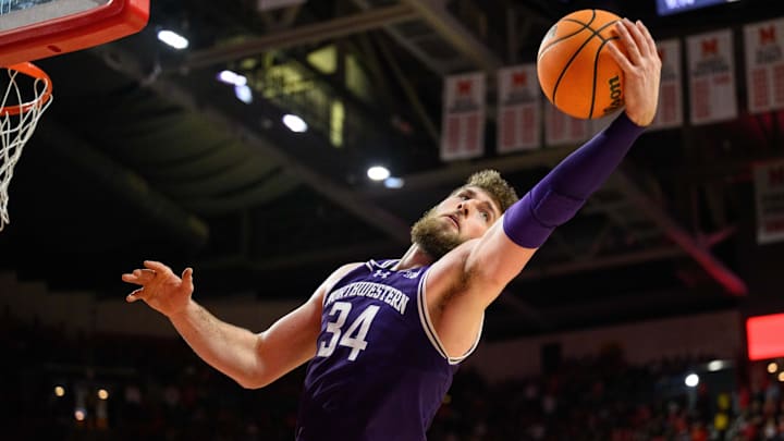 Mar 8, 2025; College Park, Maryland, USA; Northwestern Wildcats center Matthew Nicholson (34) rebounds the ball during the second half against the Maryland Terrapins at Xfinity Center. Mandatory Credit: Reggie Hildred-Imagn Images