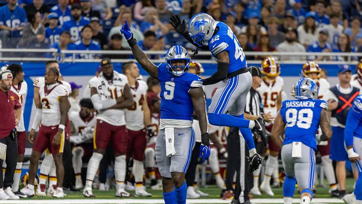 Aug 22, 2026; Detroit, Michigan, USA;  Detroit Lions defensive end Derrick Moore (9) celebrates his sack on Washington Commanders quarterback Sam Hartman (15) with cornerback Aamaris Brown (42) in the second quarter at Ford Field.  Mandatory Credit: David Reginek-Imagn Images