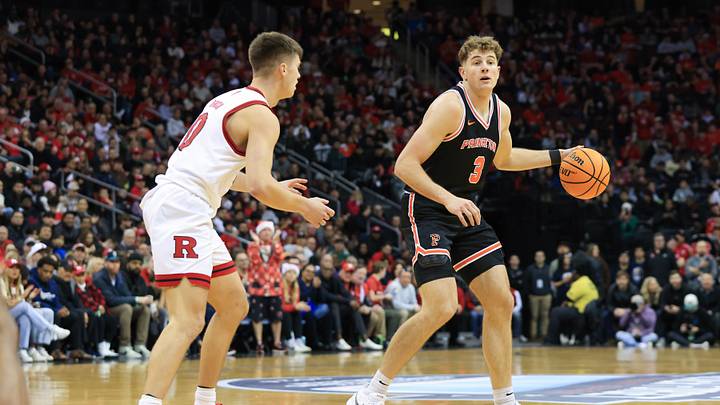 Dec 21, 2024; Newark, New Jersey, USA; Princeton Tigers forward Caden Pierce (3) looks to pass against Rutgers Scarlet Knights guard Jordan Derkack (0) during the second half at Prudential Center. Mandatory Credit: Tom Horak-Imagn Images