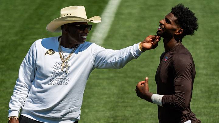 Deion Sanders gives his son, Cleveland Browns quarterback Shedeur Sanders (2) a little love at the conclusion of the second day of training camp, July 30, 2026, in Berea, Ohio.