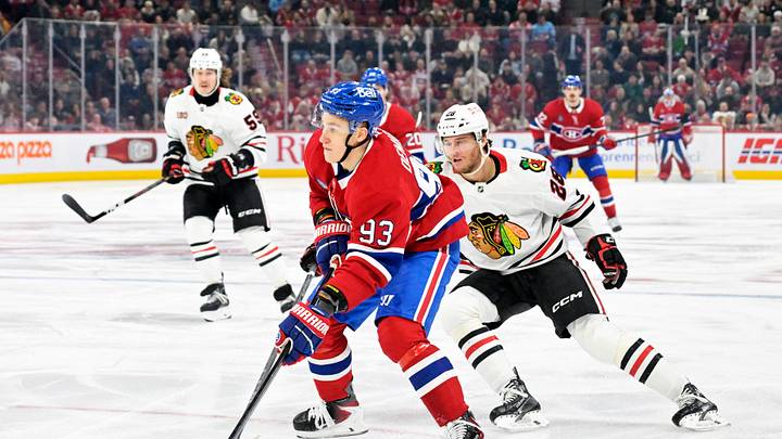 Dec 18, 2025; Montreal, Quebec, CAN; Montreal Canadiens forward Ivan Demidov (93) plays the puck and Chicago Blackhawks forward Andre Burakovsky (28) defends during the first period at the Bell Centre. Mandatory Credit: Eric Bolte-Imagn Images