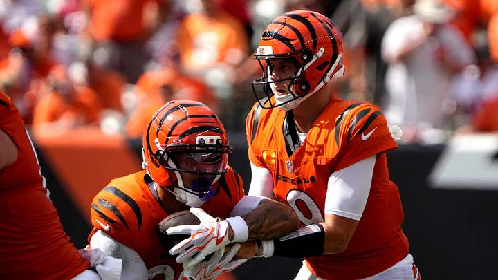 Cincinnati Bengals quarterback Joe Burrow (9) hands off to  running back Chase Brown (30) in the 4th quarter at Paycor Stadium on September 13, 2026. The Bengals beat the Tampa Bay Buccaneers 27-33.