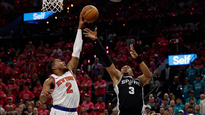 Jun 3, 2026; San Antonio, Texas, USA; New York Knicks guard Miles McBride (2) blocks the shot of San Antonio Spurs forward Keldon Johnson (3) in the second half during game one of the 2026 NBA Finals at Frost Bank Center. Mandatory Credit: Geoff Burke-Imagn Images