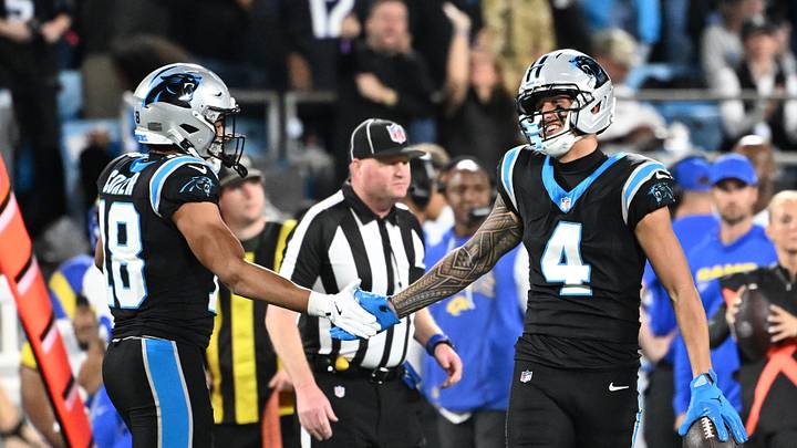 Jan 10, 2026; Charlotte, NC, USA; Carolina Panthers wide receiver Tetairoa McMillan (4) reacts with wide receiver Jalen Coker (18) in the second half during the NFC Wild Card Round game at Bank of America Stadium. Mandatory Credit: Bob Donnan-Imagn Images Jan 10, 2026; Charlotte, NC, USA; Carolina Panthers wide receiver Tetairoa McMillan (4) reacts with wide receiver Jalen Coker (18) in the second half during the NFC Wild Card Round game at Bank of America Stadium. Mandatory Credit: Bob Donnan-Imagn Images