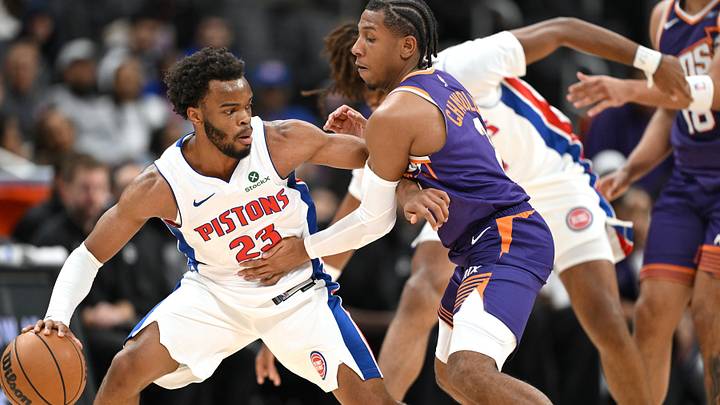 Oct 5, 2026; Detroit, Michigan, USA;  Detroit Pistons guard Ebuka Okorie (23) tries to keep the ball away from Phoenix Suns guard Kennedy Chandler (2) in the fourth quarter at Little Caesars Arena.  Mandatory Credit: Lon Horwedel-Imagn Images