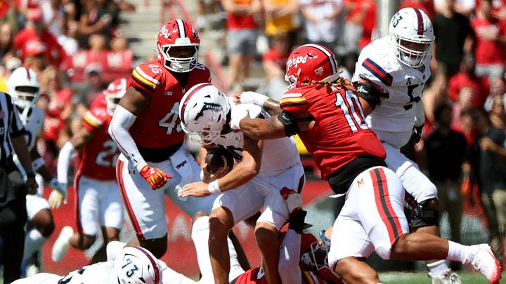 Maryland Terrapins defensive lineman Zahir Mathis (9) take down Florida Atlantic Owls quarterback Caden Veltkamp (10) Maryland Terrapins defensive lineman Zahir Mathis (9) take down Florida Atlantic Owls quarterback Caden Veltkamp (10)