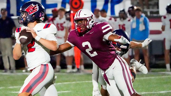 Prattville's Jason Crenshaw (2) pressures Oak Mountain quarterback John Vacarella (2) during their game in Prattville, Ala., on Thursday, October 8, 2026.