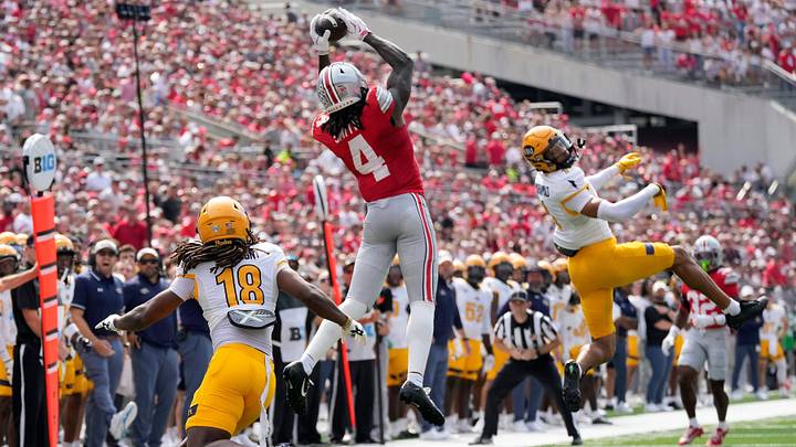 Ohio State Buckeyes wide receiver Jeremiah Smith (4) makes a catch against Kent State Golden Flashes defensive back Norey Johnson (18) in the first quarter of the NCAA football game at Ohio Stadium on Sept. 19, 2026. Ohio State Buckeyes wide receiver Jeremiah Smith (4) makes a catch against Kent State Golden Flashes defensive back Norey Johnson (18) in the first quarter of the NCAA football game at Ohio Stadium on Sept. 19, 2026.