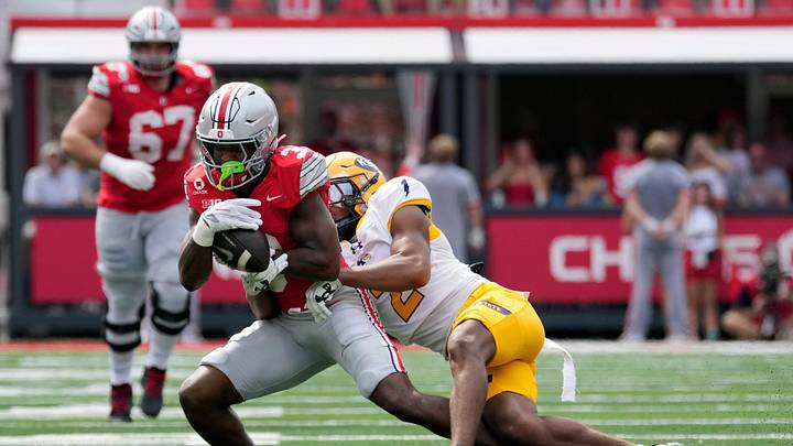 Ohio State Buckeyes wide receiver Devin McCuin (3) makes a catch against Kent State Golden Flashes defensive back Joel Cordoba (2) in the first quarter of the NCAA football game at Ohio Stadium on Sept. 19, 2026.