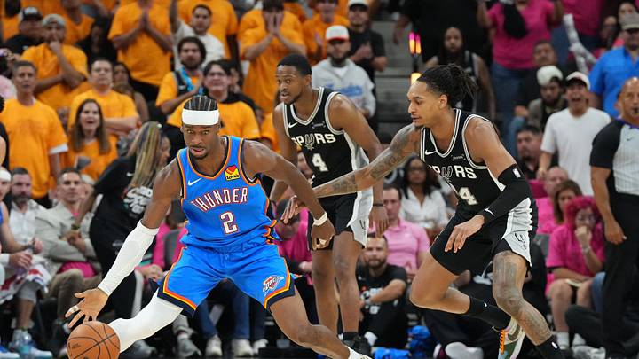 May 22, 2026; San Antonio, Texas, USA; Oklahoma City Thunder guard Shai Gilgeous-Alexander (2) dribbles the ball against San Antonio Spurs guard Devin Vassell (24) in the second half during game three of the western conference finals for the 2026 NBA playoffs at Frost Bank Center. Mandatory Credit: Scott Wachter-Imagn Images May 22, 2026; San Antonio, Texas, USA; Oklahoma City Thunder guard Shai Gilgeous-Alexander (2) dribbles the ball against San Antonio Spurs guard Devin Vassell (24) in the second half during game three of the western conference finals for the 2026 NBA playoffs at Frost Bank Center. Mandatory Credit: Scott Wachter-Imagn Images