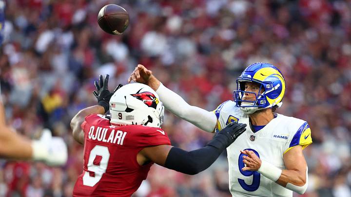 Dec 7, 2025; Glendale, Arizona, USA; Los Angeles Rams quarterback Matthew Stafford (9) throws a pass against Arizona Cardinals linebacker BJ Ojulari (9) during the second half at State Farm Stadium. Mandatory Credit: Mark J. Rebilas-Imagn Images Dec 7, 2025; Glendale, Arizona, USA; Los Angeles Rams quarterback Matthew Stafford (9) throws a pass against Arizona Cardinals linebacker BJ Ojulari (9) during the second half at State Farm Stadium. Mandatory Credit: Mark J. Rebilas-Imagn Images