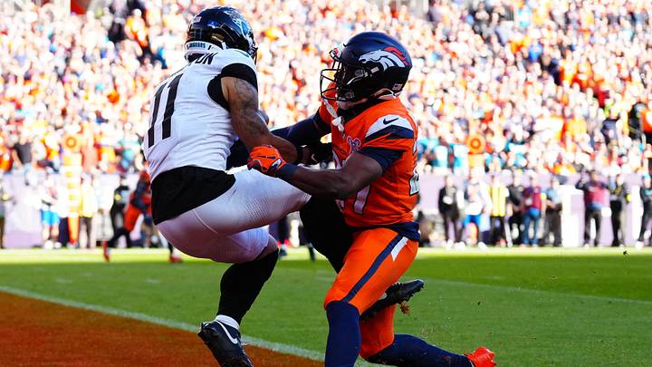 Dec 21, 2025; Denver, Colorado, USA; Jacksonville Jaguars wide receiver Parker Washington (11) makes a touchdown catch against Denver Broncos cornerback Ja'Quan McMillian (29) during the first half at Empower Field at Mile High. Mandatory Credit: Ron Chenoy-Imagn Images Dec 21, 2025; Denver, Colorado, USA; Jacksonville Jaguars wide receiver Parker Washington (11) makes a touchdown catch against Denver Broncos cornerback Ja'Quan McMillian (29) during the first half at Empower Field at Mile High. Mandatory Credit: Ron Chenoy-Imagn Images