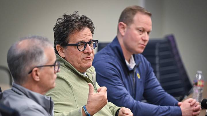 Milwaukee Brewers principal owner Mark Attanasio speaks with reporters Tuesday, February 17, 2026, at American Family Fields of Phoenix in Phoenix, Arizona. At left is Rick Schlesinger, the team’s president of business operations, and at right is Matt Arnold, president of baseball operations and general manager,