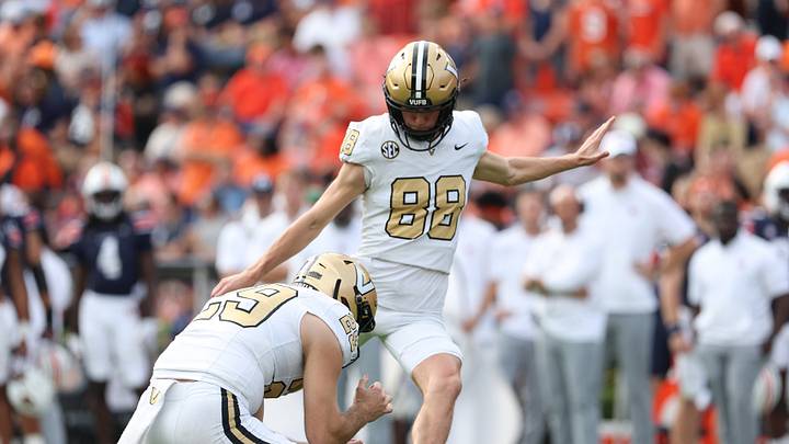 Nov 2, 2024; Auburn, Alabama, USA; Vanderbilt Commodores place kicker Brock Taylor (88) attempts an extra point from the hold of punter Jesse Mirco (29) during the fourth quarter against the Auburn Tigers at Jordan-Hare Stadium. Mandatory Credit: John Reed-Imagn Images Nov 2, 2024; Auburn, Alabama, USA; Vanderbilt Commodores place kicker Brock Taylor (88) attempts an extra point from the hold of punter Jesse Mirco (29) during the fourth quarter against the Auburn Tigers at Jordan-Hare Stadium. Mandatory Credit: John Reed-Imagn Images