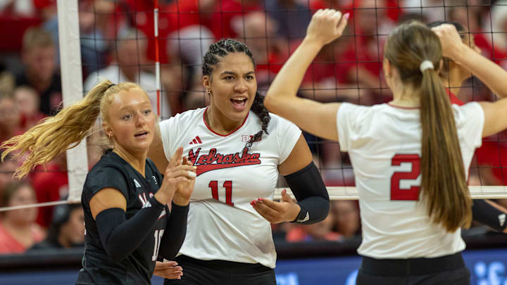 Nebraska DS/Libero Olivia Mauch, outside hitter Teraya Sigler, and setter Bergen Reilly celebrate a point during the Red-White Scrimmage on Saturday.