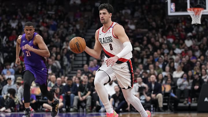 Apr 3, 2025; Toronto, Ontario, CAN; Portland Trail Blazers forward Deni Avdija (8) dribbles up court as Toronto Raptors center Orlando Robinson (21) defends during the second half at Scotiabank Arena. Mandatory Credit: John E. Sokolowski-Imagn Images