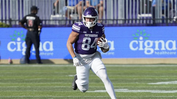 Sep 27, 2025; Evanston, Illinois, USA; Northwestern Wildcats tight end Hunter Welcing (84) catches a pass against the UCLA Bruins during the first half at Northwestern Medicine Field at Martin Stadium. Mandatory Credit: David Banks-Imagn Images