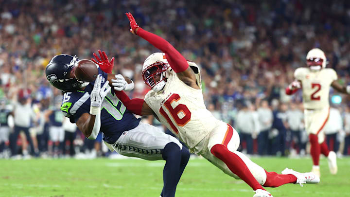 Sep 25, 2025; Glendale, Arizona, USA;  Seattle Seahawks wide receiver Tory Horton (15) cannot make a catch against Arizona Cardinals cornerback Max Melton (16) in the second quarter at State Farm Stadium. Mandatory Credit: Mark J. Rebilas-Imagn Images