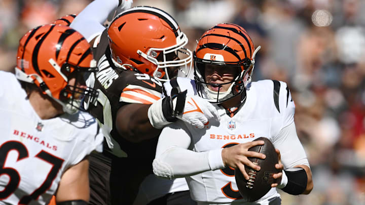 Oct 20, 2024; Cleveland, Ohio, USA; Cleveland Browns defensive tackle Shelby Harris (93) sacks Cincinnati Bengals quarterback Joe Burrow (9) during the first quarter at Huntington Bank Field. Mandatory Credit: Ken Blaze-Imagn Images