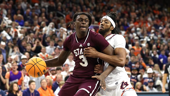 Jan 14, 2025; Auburn, Alabama, USA;  Mississippi State Bulldogs forward KeShawn Murphy (3) is pressured by Auburn Tigers forward Chaney Johnson (31) during the first half at Neville Arena. Mandatory Credit: John Reed-Imagn Images