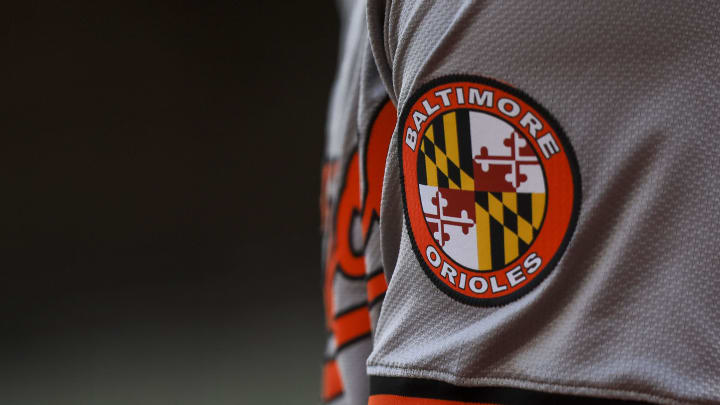 May 5, 2024; Cincinnati, Ohio, USA; The Baltimore Orioles logo on the sleeve of designated hitter Gunnar Henderson (2) as he prepares on deck during the seventh inning against the Cincinnati Reds at Great American Ball Park. 