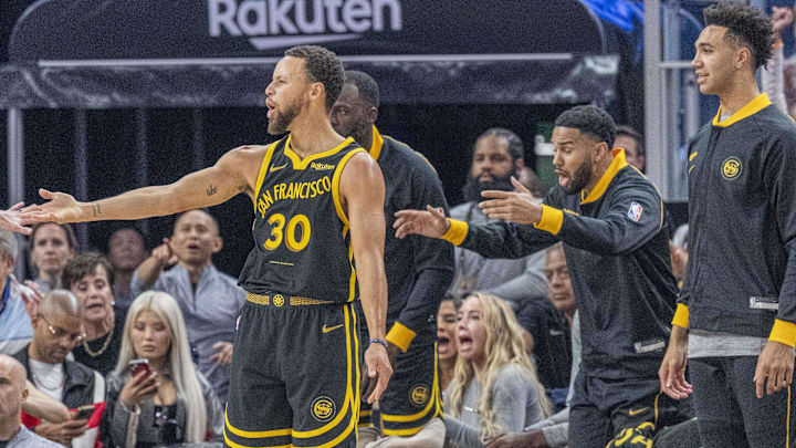 Golden State Warriors guard Stephen Curry (30) reacts on the foul against the Cleveland Cavaliers during the first quarter at Chase Center. Mandatory Credit: Neville E. Guard-Imagn Images