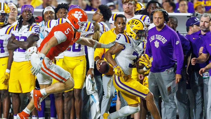 Sep 5, 2026; Baton Rouge, Louisiana, USA; LSU Tigers wide receiver Eugene Wilson III (3) catches a pass for a first down against Clemson Tigers safety Ronan Hanafin (5) during the second half at Tiger Stadium. Mandatory Credit: Stephen Lew-Imagn Images Sep 5, 2026; Baton Rouge, Louisiana, USA; LSU Tigers wide receiver Eugene Wilson III (3) catches a pass for a first down against Clemson Tigers safety Ronan Hanafin (5) during the second half at Tiger Stadium. Mandatory Credit: Stephen Lew-Imagn Images