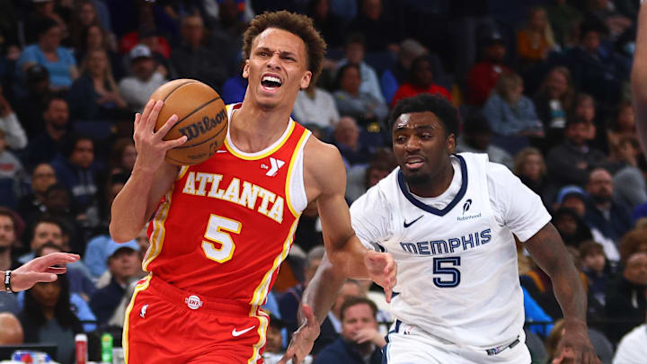 Mar 3, 2025; Memphis, Tennessee, USA; Atlanta Hawks guard Dyson Daniels (5)drives to the basket as Memphis Grizzlies guard Vince Williams Jr. (5) defends during the second quarter at FedExForum. Mandatory Credit: Petre Thomas-Imagn Images