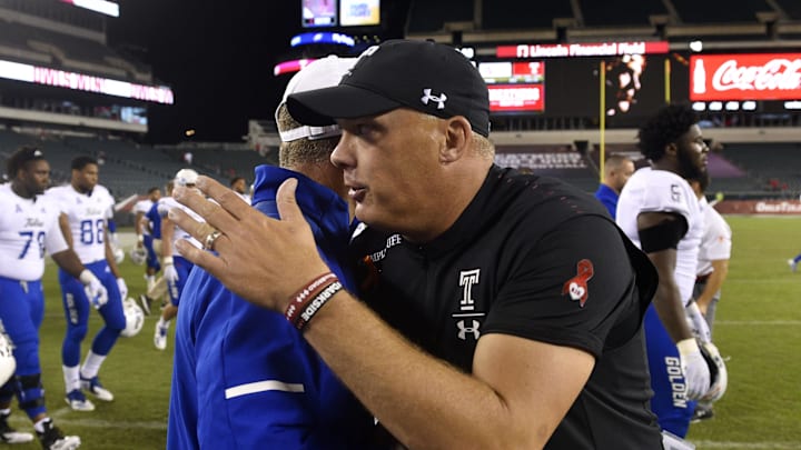 Sep 20, 2018; Philadelphia, PA, USA; Tulsa Golden Hurricane head coach Phillip Montgomery and Temple Owls head coach Geoff Collins, right, come together after a game at Lincoln Financial Field. Mandatory Credit: Derik Hamilton-Imagn Images