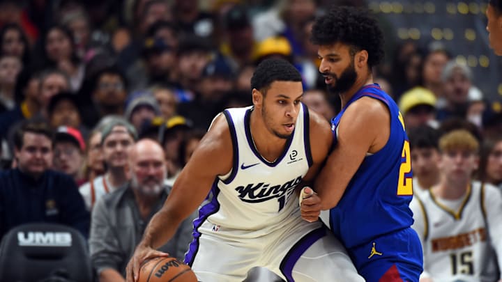 Nov 22, 2025; Denver, Colorado, USA; Sacramento Kings forward Keegan Murray (13) handles the ball against Denver Nuggets guard Jamal Murray (27) during the first half at Ball Arena. Mandatory Credit: Christopher Hanewinckel-Imagn Images
