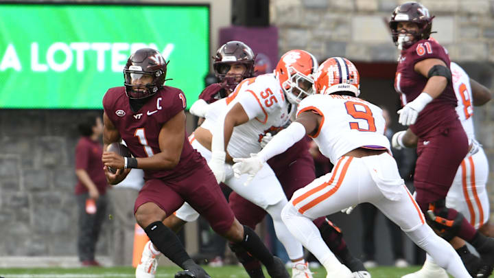 Nov 9, 2024; Blacksburg, Virginia, USA;  Virginia Tech Hokies quarterback Kyron Drones (1) runs the ball against the Clemson Tigers during the first quarter at Lane Stadium. Mandatory Credit: Brian Bishop-Imagn Images
