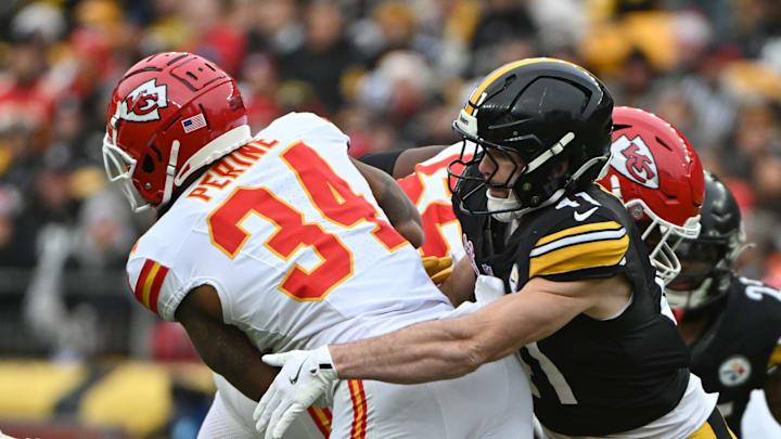 Dec 25, 2024; Pittsburgh, Pennsylvania, USA; Pittsburgh Steelers linebacker Payton Wilson (41) tackles Kansas City Chiefs running back Samaje Perine (34) during the second quarter at Acrisure Stadium. Mandatory Credit: Barry Reeger-Imagn Images