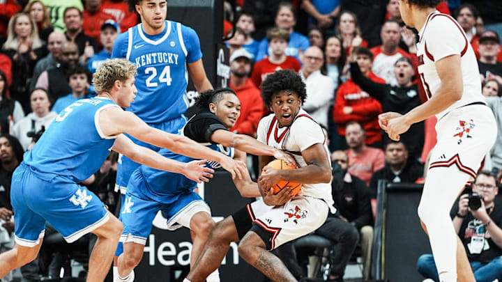 Louisville Cardinals guard Adrian Wooley (14) Louisville Cardinals guard Adrian Wooley (14)