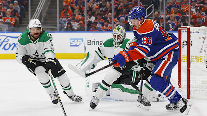 May 27, 2024; Edmonton, Alberta, CAN; Dallas Stars defensemen Chris Tanev (3) and Edmonton Oilers forward Ryan Nugent-Hopkins (93) chase a loose puck during the first period in game three of the Western Conference Final of the 2024 Stanley Cup Playoffs at Rogers Place. Mandatory Credit: Perry Nelson-USA TODAY Sports
