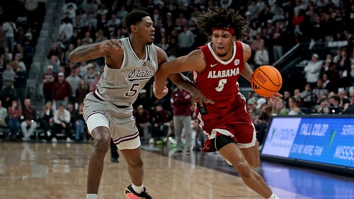 Jan 13, 2026; Starkville, Mississippi, USA; Alabama Crimson Tide forward Amari Allen (5) drives to the basket as Mississippi State Bulldogs guard Shawn Jones Jr. (5) defends during the second half at Humphrey Coliseum. Mandatory Credit: Petre Thomas-Imagn Images
