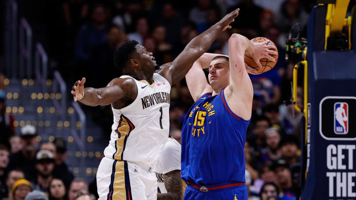 Jan 12, 2024; Denver, Colorado, USA; Denver Nuggets center Nikola Jokic (15) controls the ball under pressure from New Orleans Pelicans forward Zion Williamson (1) in the fourth quarter at Ball Arena. Jan 12, 2024; Denver, Colorado, USA; Denver Nuggets center Nikola Jokic (15) controls the ball under pressure from New Orleans Pelicans forward Zion Williamson (1) in the fourth quarter at Ball Arena.