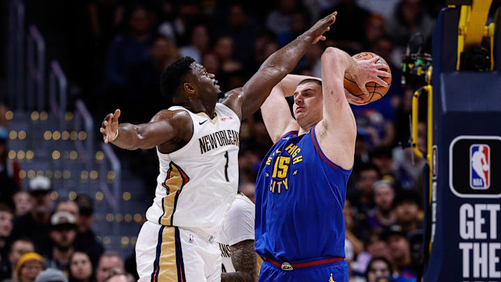 Jan 12, 2024; Denver, Colorado, USA; Denver Nuggets center Nikola Jokic (15) controls the ball under pressure from New Orleans Pelicans forward Zion Williamson (1) in the fourth quarter at Ball Arena. Mandatory Credit: Isaiah J. Downing-Imagn Images