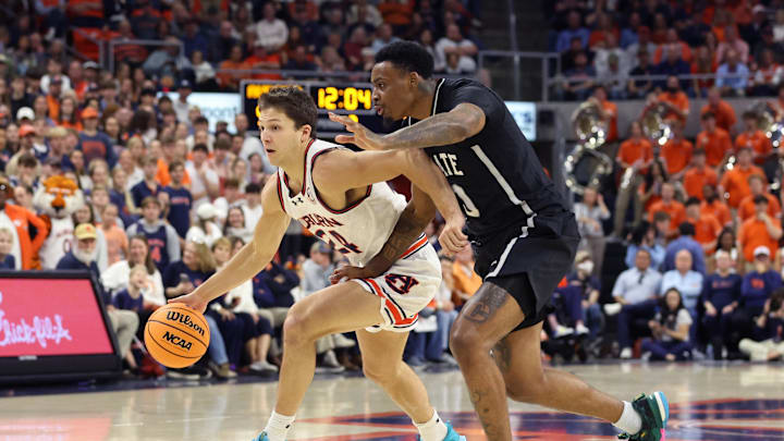 Mar 2, 2024; Auburn, Alabama, USA;  Auburn Tigers guard Lior Berman (24) drives past Mississippi
