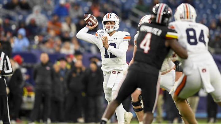 Dec 30, 2023; Nashville, TN, USA; Auburn Tigers quarterback Holden Geriner (12) throws a pass against the Maryland Terrapins during the second half at Nissan Stadium. Mandatory Credit: Steve Roberts-Imagn Images Dec 30, 2023; Nashville, TN, USA; Auburn Tigers quarterback Holden Geriner (12) throws a pass against the Maryland Terrapins during the second half at Nissan Stadium. Mandatory Credit: Steve Roberts-Imagn Images
