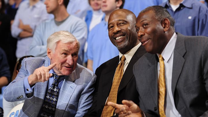 Feb 7, 2009; Chapel Hill, NC, USA; North Carolina Tar Heels former head coach Dean Smith and former players James Worthy and Bob McAdoo are honored for their Hall of Fame careers during a halfime ceremony during the Tar Heels 76-61 victory against the Cavaliers at the Dean E. Smith Center. Mandatory Credit: Bob Donnan-Imagn Images