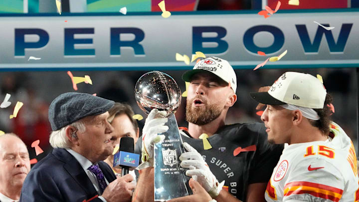 Super Bowl 57: Kansas City Chiefs quarterback Patrick Mahomes passes the the Lombardi Trophy to Travis Kelce after winning the Super Bowl against the Philadelphia Eagles at State Farm Stadium on Feb 12, 2023.